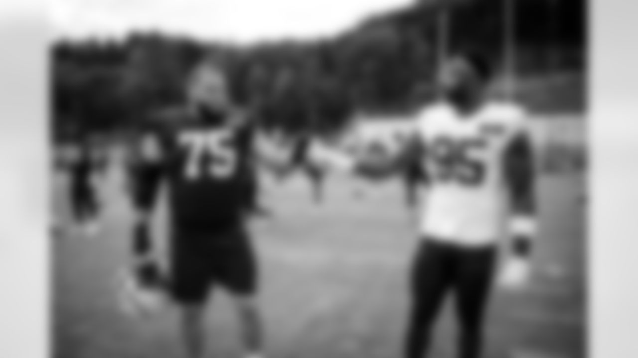 Offensive guard Joel Bitonio (75) and Defensive end Myles Garrett (95) during Day 6 of Training Camp at The Greenbrier on July 30, 2023.