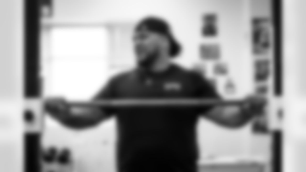 Defensive tackle Siaki Ika works out during a visit to East High School in Salt Lake City, Utah on May 9, 2023.