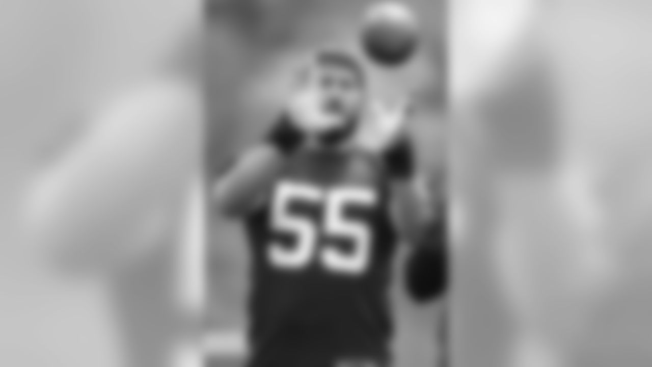 Offensive lineman Alex Mack catches a ball during the first Browns OTA of the 2015 season.