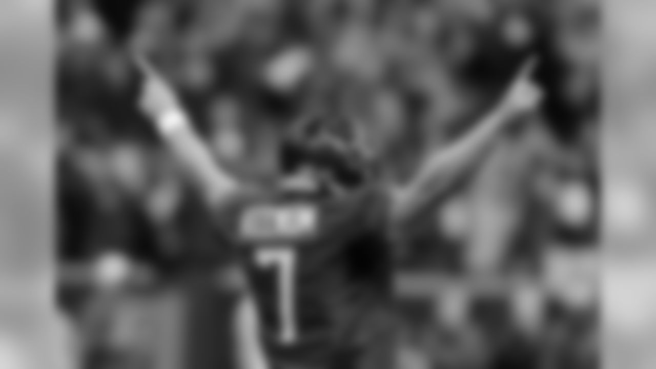 Houston Texans' Case Keenum celebrates teammate Andre Johnson's touchdown during the first quarter of an NFL football game against the Indianapolis Colts, Sunday, Nov. 3, 2013, in Houston. (AP Photo/Patric Schneider)