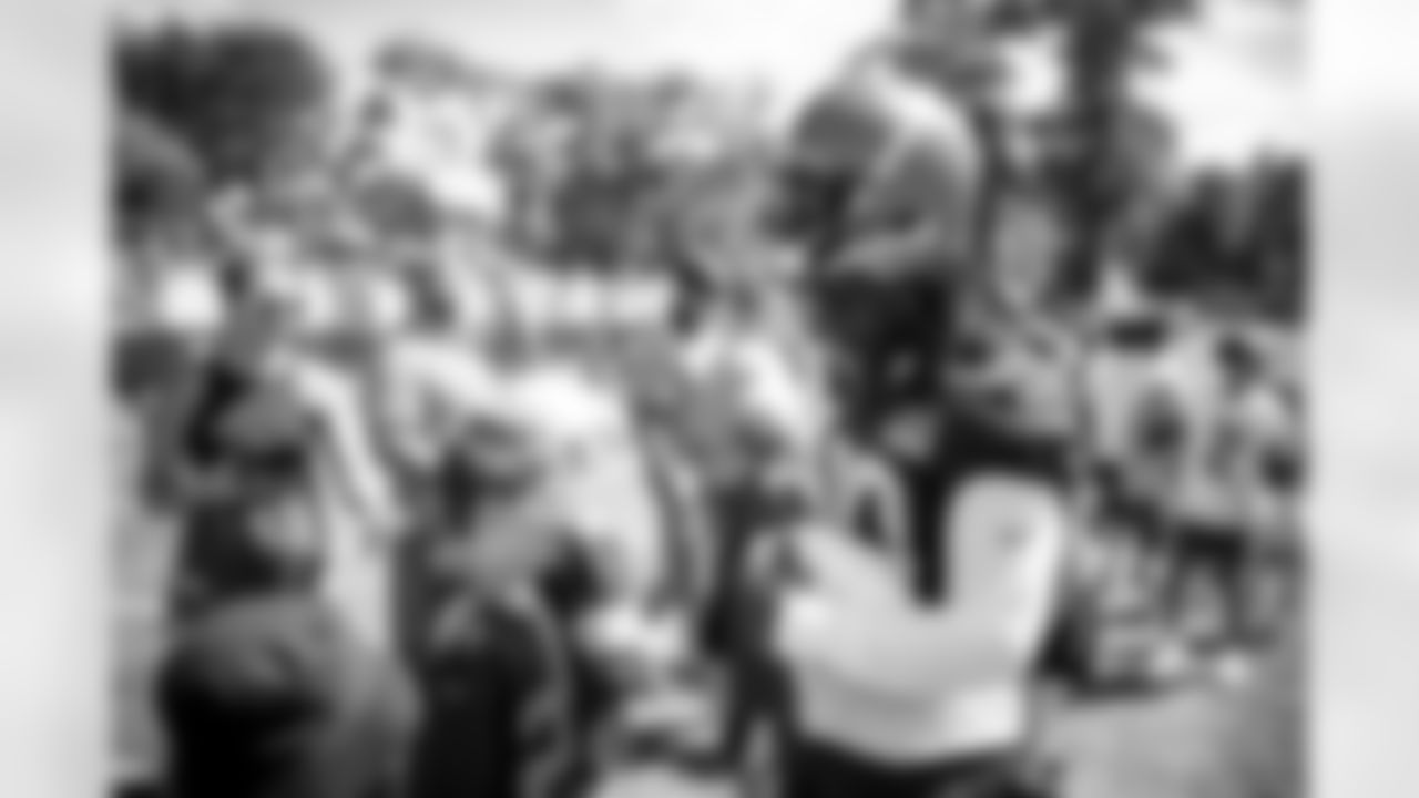 Running Back D'Ernest Johnson (30) signs autographs for fans after the fourth day of training camp at CrossCountry Mortgage Campus on July 30, 2022.