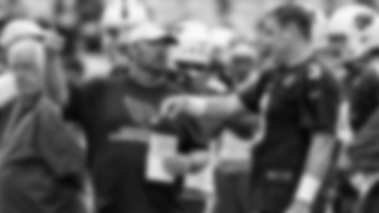 Arizona Cardinals quarterback Carson Palmer (3) talks with quarterbacks coach Freddie Kitchens during the first day of the NFL football team's training camp, Saturday, July 26, 2014, in Glendale, Ariz. (AP Photo/Ross D. Franklin)