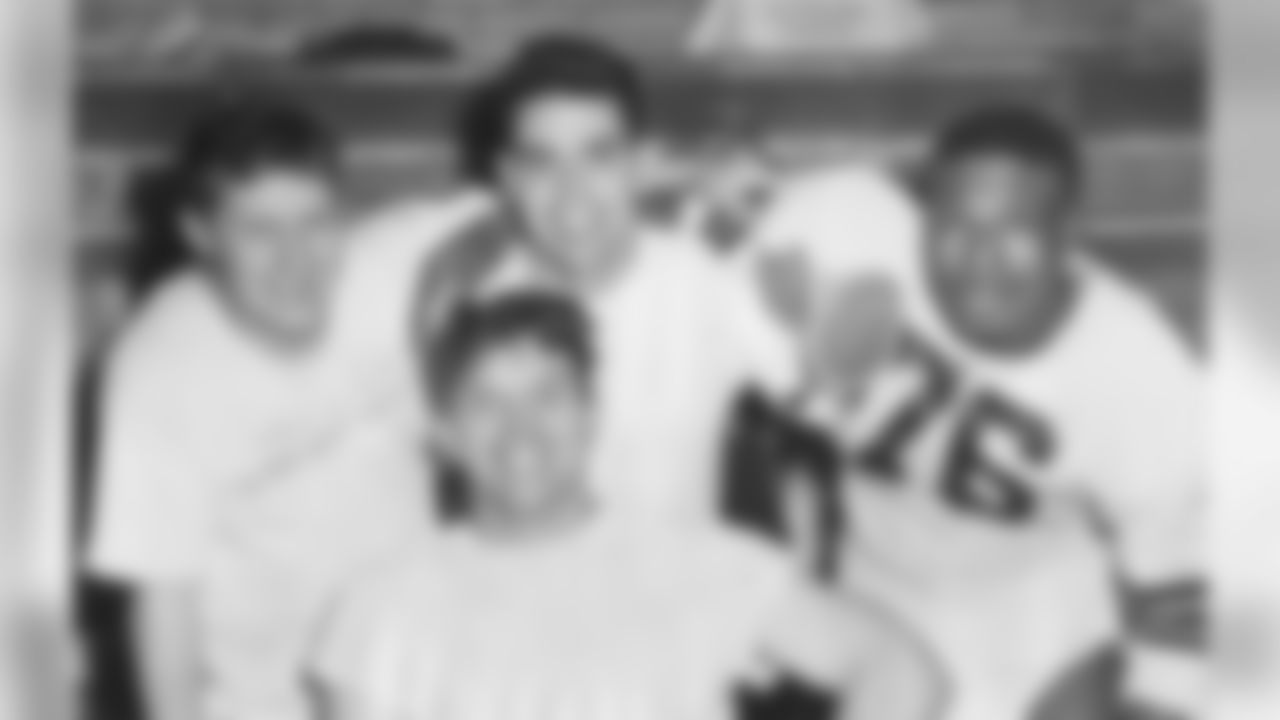 Edgar Jones, Otto Graham, Marion Motley and Lou Saban celebrate winning the 1948 AAFC Championship Game.