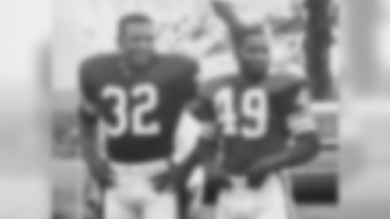 Jim Brown and Bobby Mitchell taking time for photographs during camp in 1961.