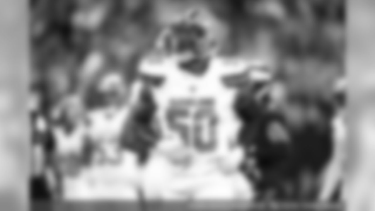 Defensive end Chris Smith (50)