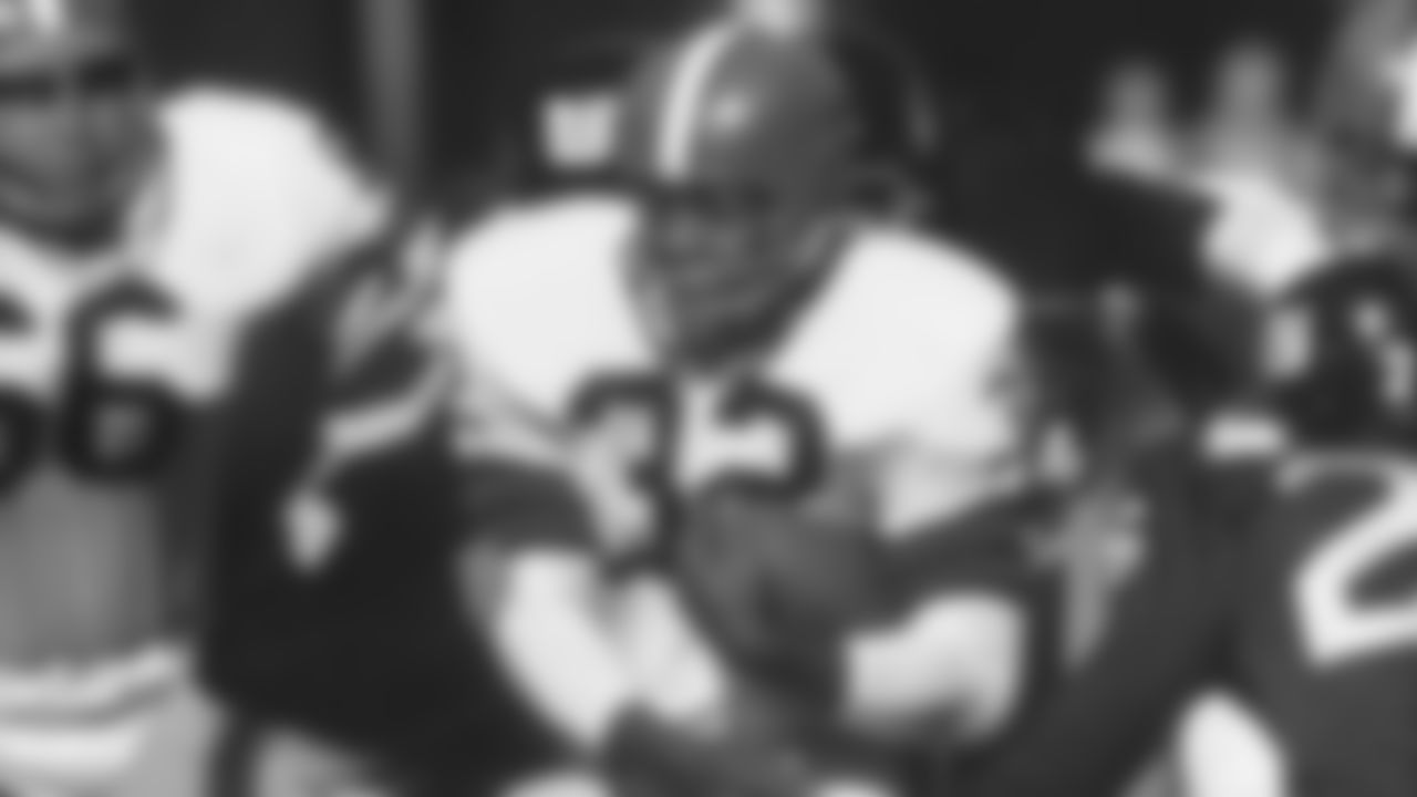 Jim Brown runs through the New York defense during a game against the Giants.