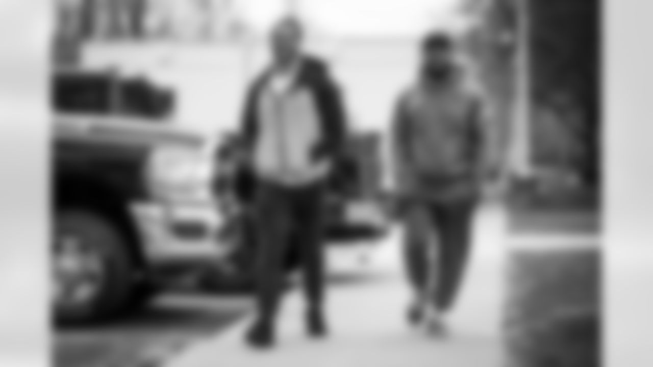 Linebacker Jordan Kunaszyk (51) and Running back John Kelly Jr. (41) arrives for the start of offseason workouts at CrossCountry Mortgage Campus on April 17, 2023.