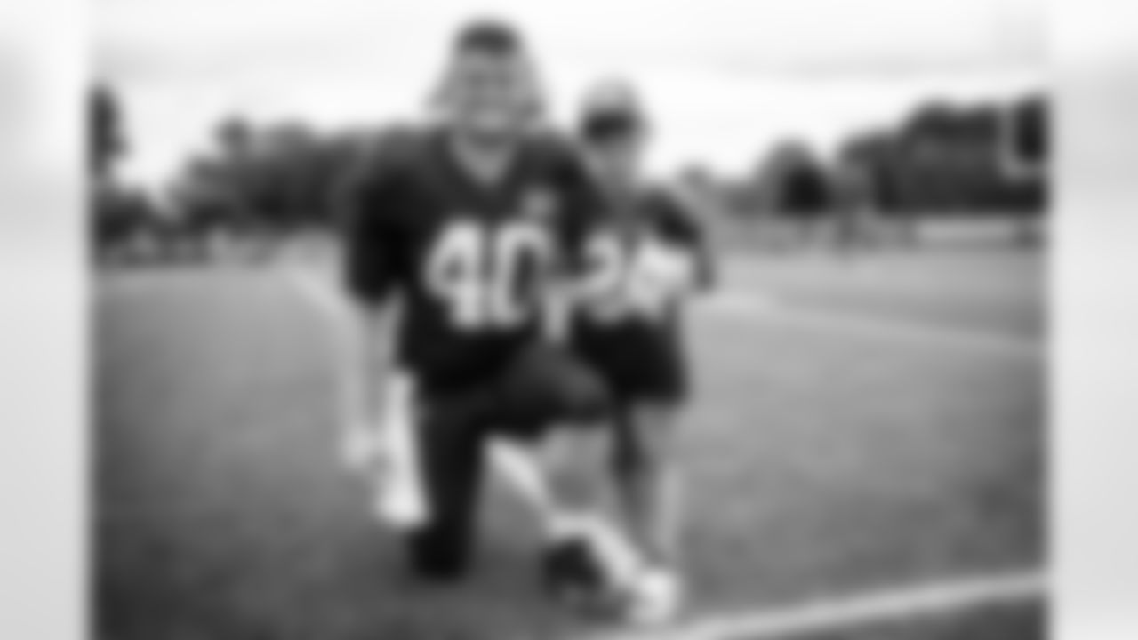 Fullback Johnny Stanton IV (40) and a fan during the eleventh day of training camp at CrossCountry Mortgage Campus on August 9, 2022.