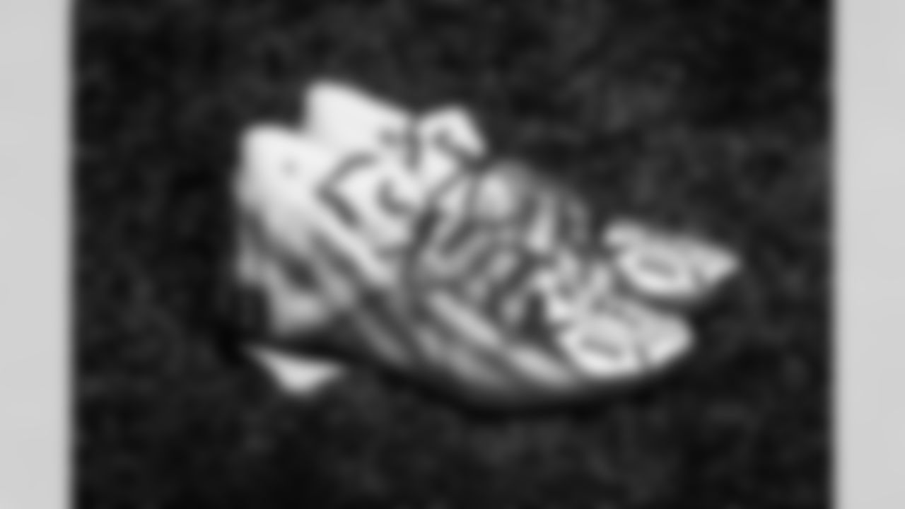 2022 My Cause My Cleats Photoshoot - Defensive end Isaac Rochell (98) - International Association of Firefighters Cleveland Branch
