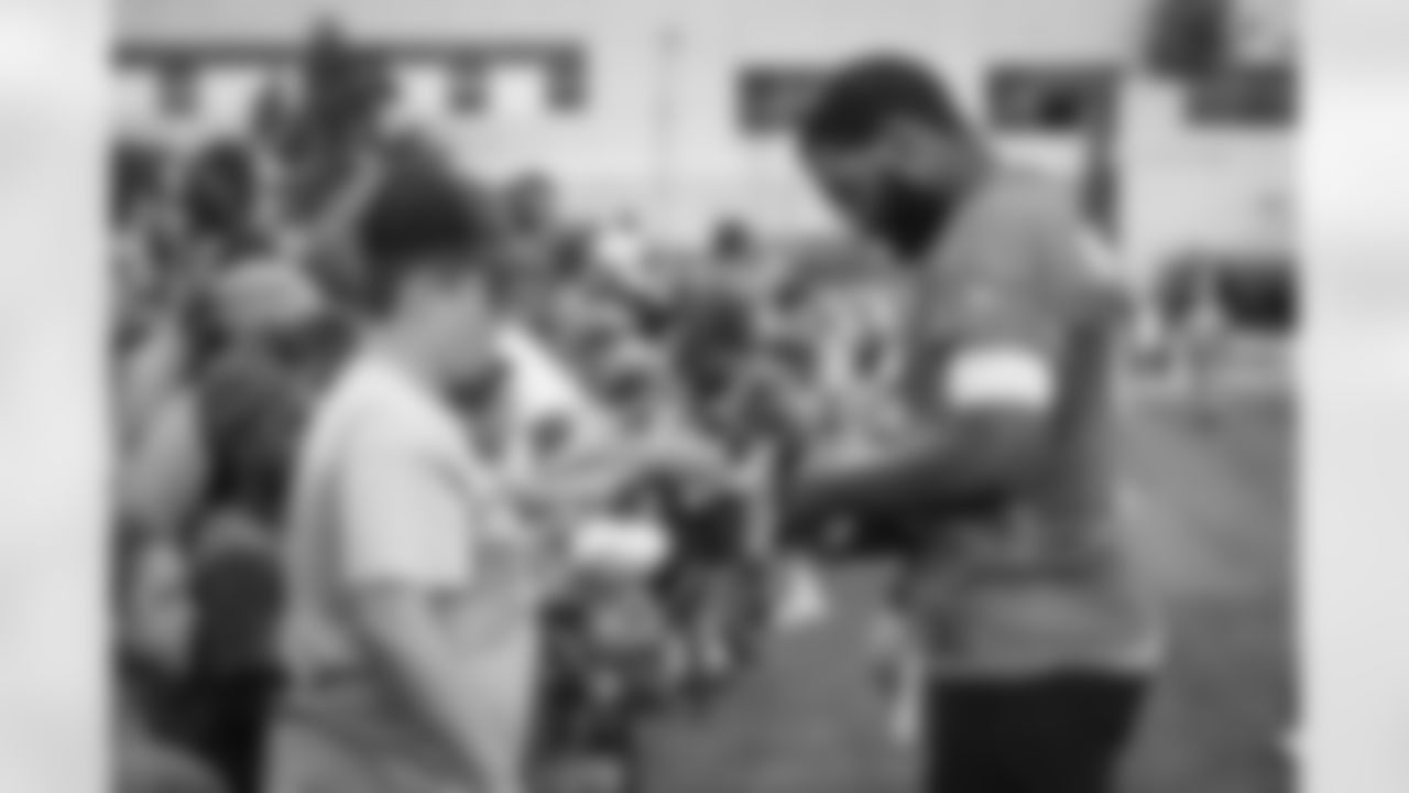 Quarterback Jacoby Brissett (7) signs autographs for fans during the fourteenth day of training camp at CrossCountry Mortgage Campus on August 16, 2022.