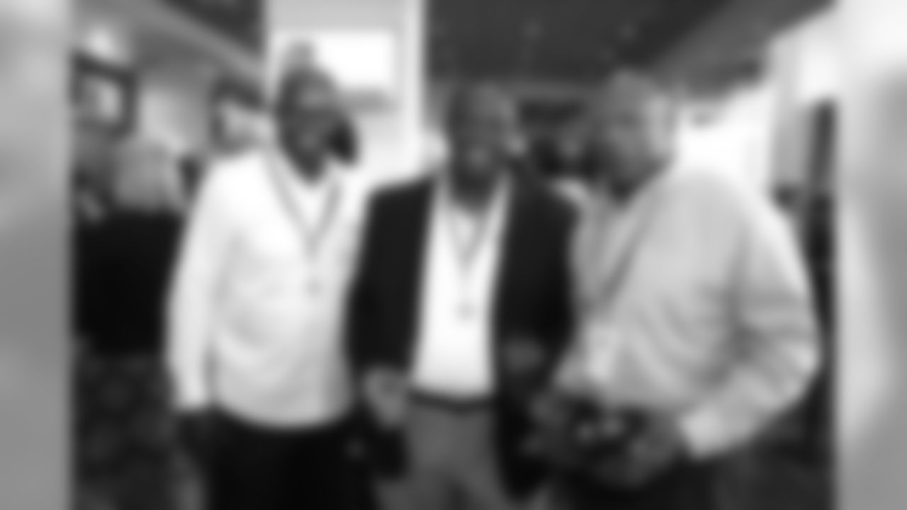 Former Cleveland Browns players Kevin Mack, left, Major Everett, center, and Hanford Dixon, right, pause for a picture at Taste of the Browns.