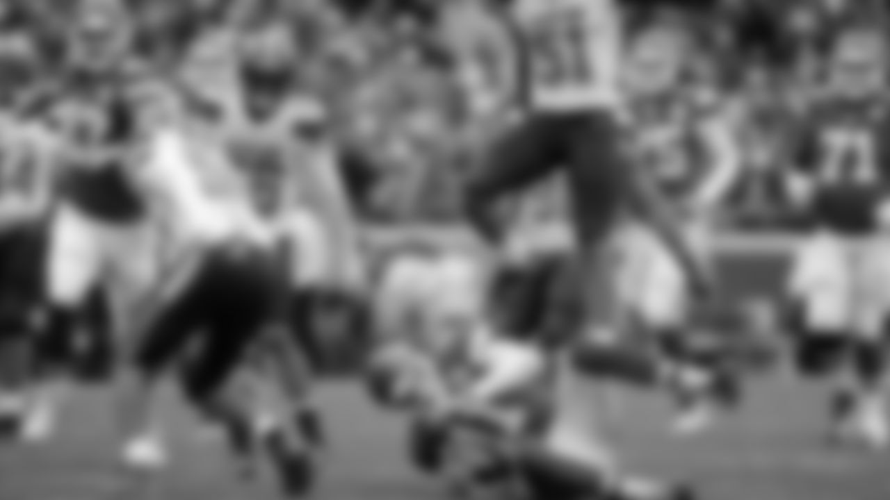 Cleveland Browns linebacker Barkevious Mingo (51) jumps over Kansas City Chiefs quarterback Alex Smith (11)
