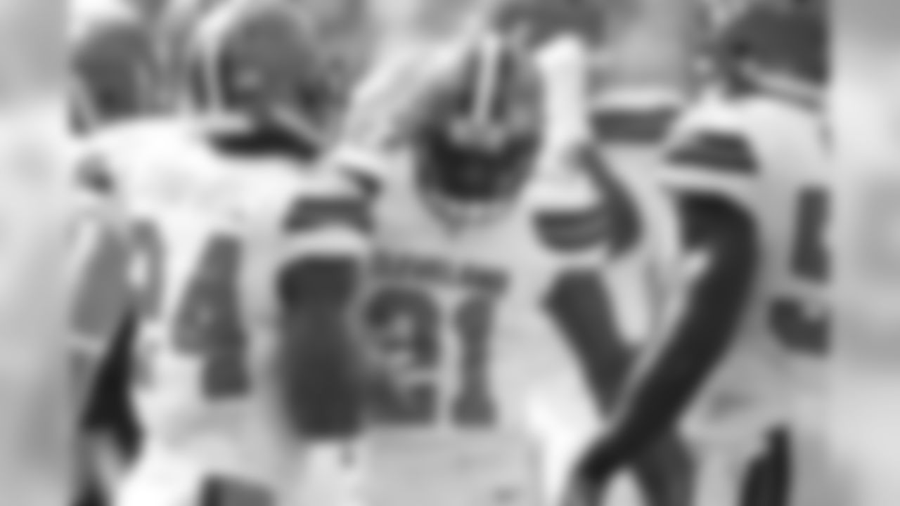DB Ibraheim Campbell (left) congratulates DB Jamar Taylor (middle) after Taylor's tackle.