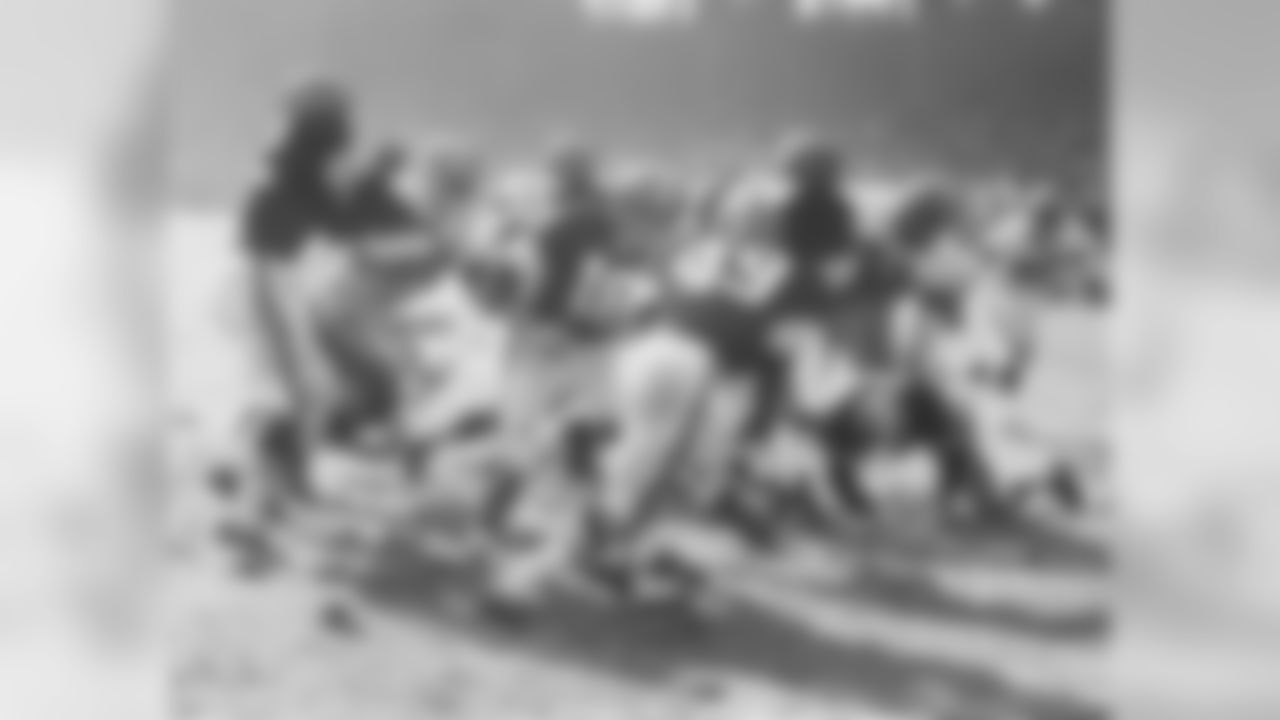 1960 – For one season only, the Browns add two brown stripes that flank the existing white center striped helmets along with the brown jersey numbers on the side.