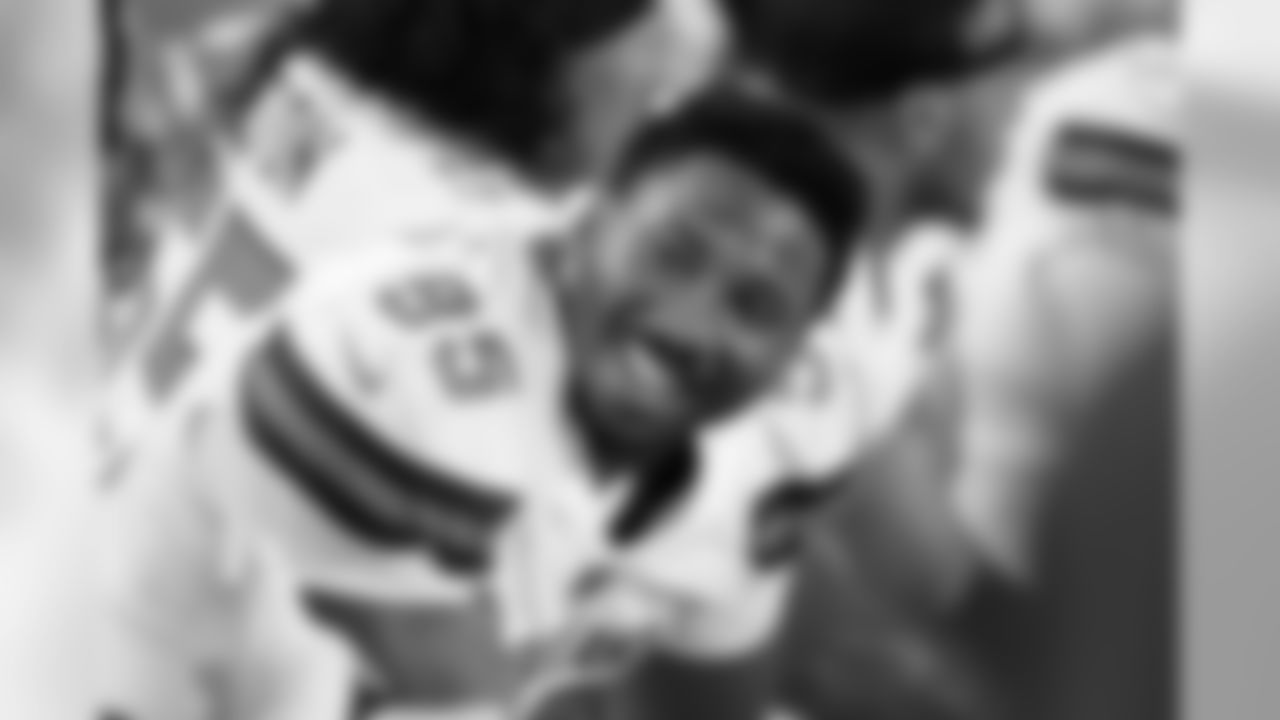 DL Myles Garrett smiles on the sideline.