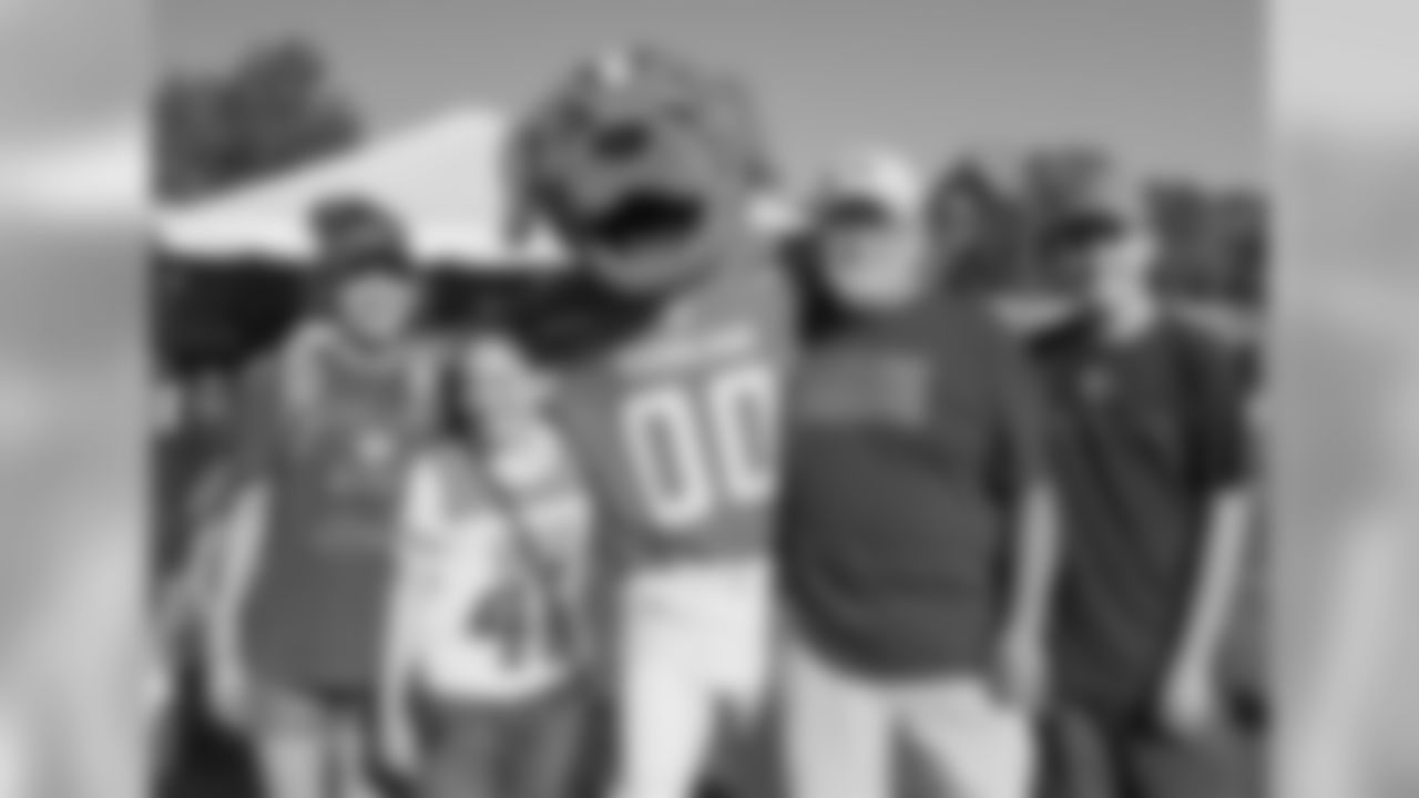 Fans pose for a photo with Chomps.