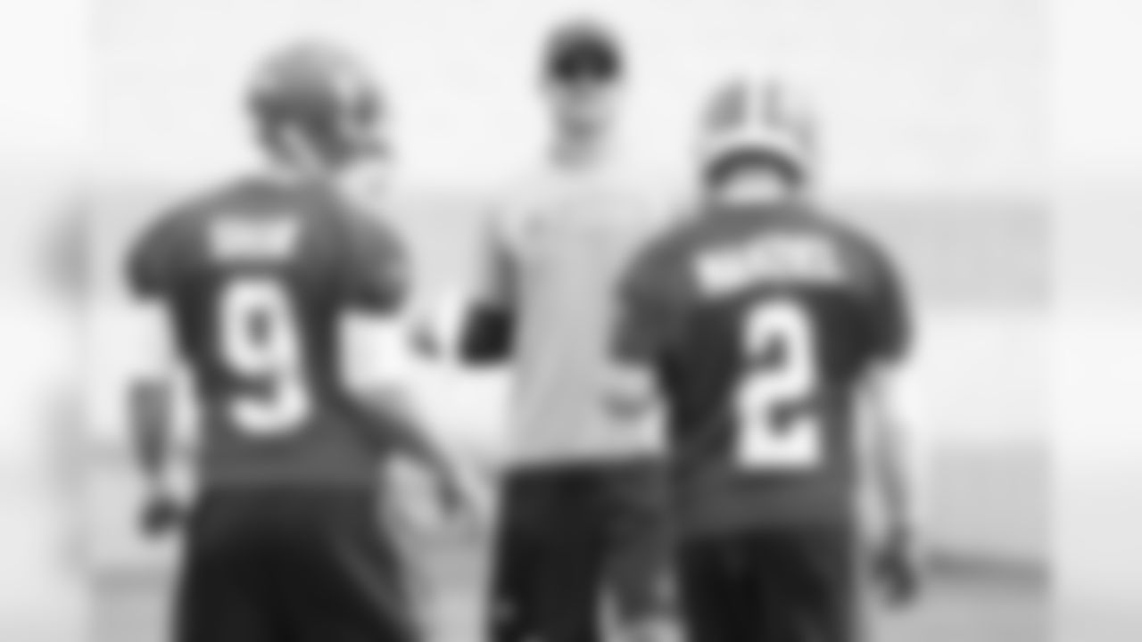 Quarterbacks coach Kevin O'Connell talks to quarterbacks Johnny Manziel (2) and Connor Shaw (9).
