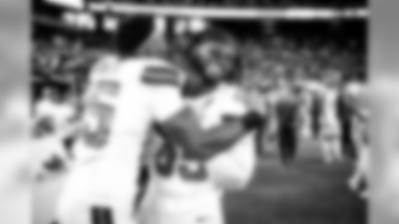 Defensive end Myles Garrett (95) and Defensive tackle Larry Ogunjobi (65)