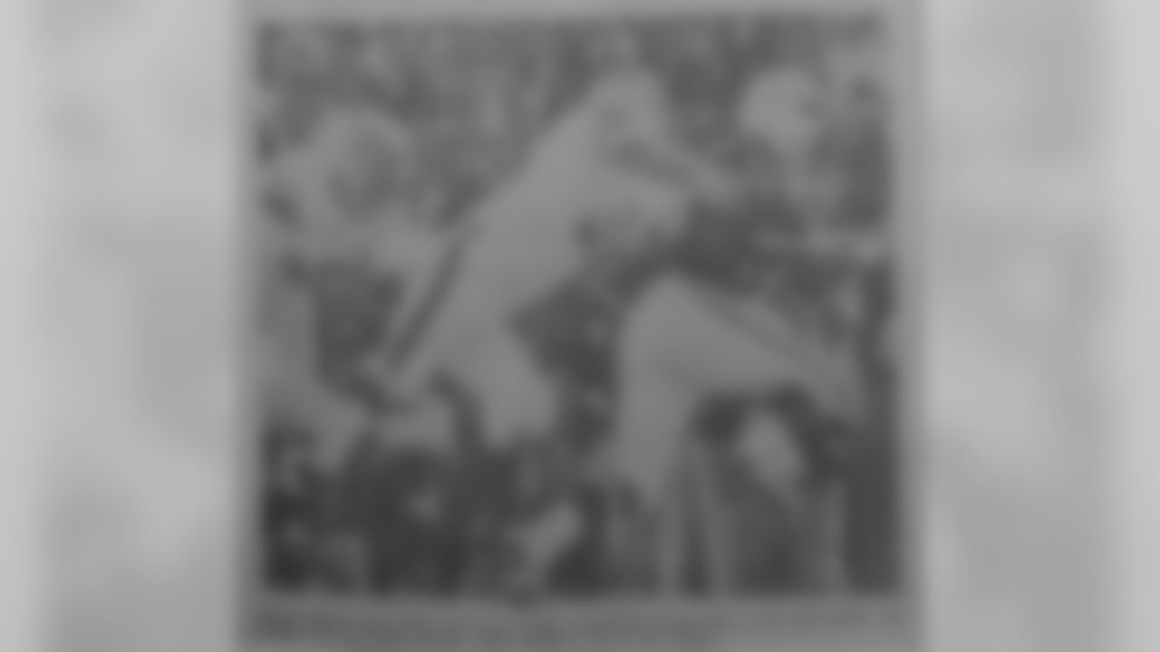 Dale Lindsey sacking Eagles quarterback George Mira in the third quarter.