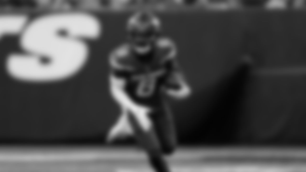 New York Jets wide receiver Elijah Moore (8) runs with the ball against the Detroit Lions during an NFL football game Sunday, Dec. 18, 2022, in East Rutherford, N.J.