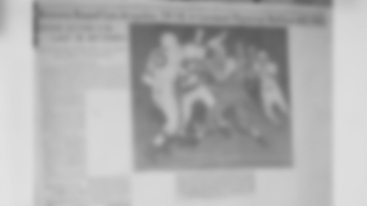 Headline the next day with a photo of Boedeker touchdown.