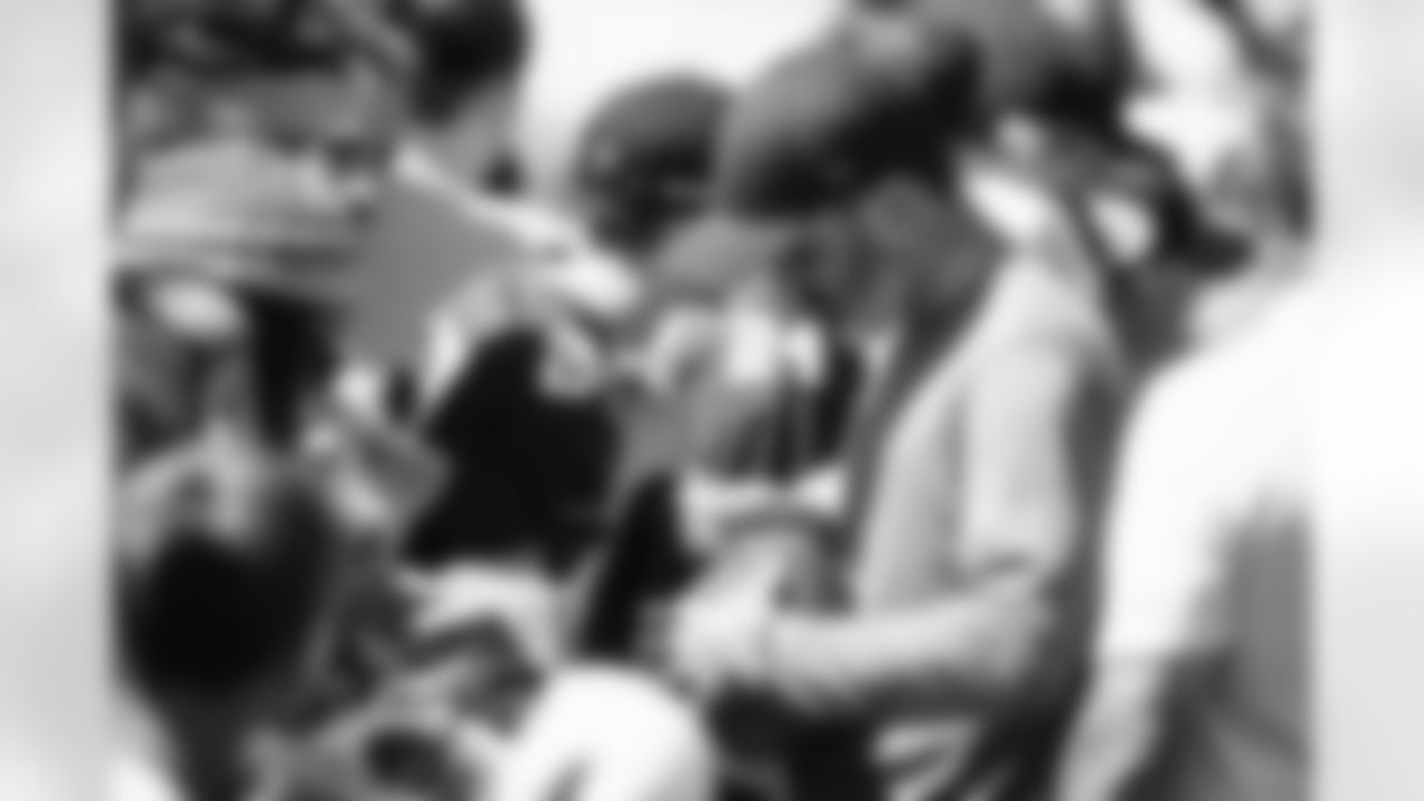 Head Coach Kevin Stefanski signs autographs for fans during the fourth day of training camp at CrossCountry Mortgage Campus on July 30, 2022.