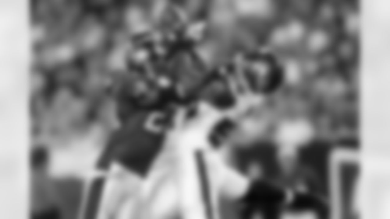 28 RB Warrick Dunn breaks up a possible interception