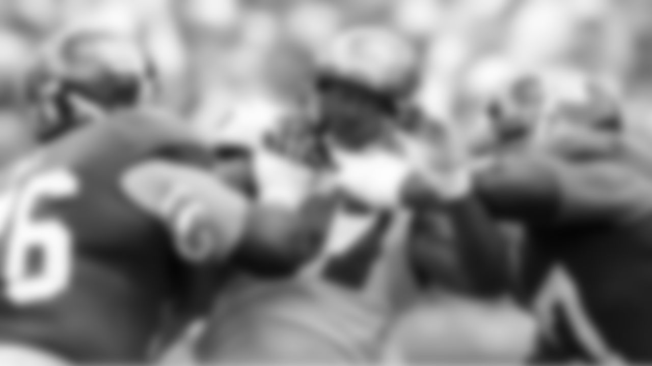 97 DE Jimmy Wilkerson gets double-teamed trying to break through the line