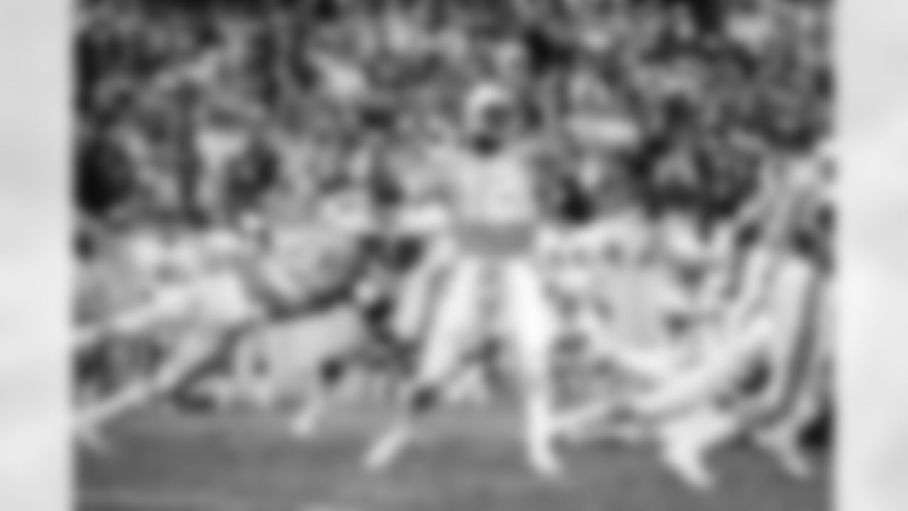 TAMPA, FL - DECEMBER 6: Quarterback Doug Williams #12 of the Tampa Bay Buccaneers passes the ball against the Atlanta Falcons while Running back James Wilder #32 blocks Falcons player at Tampa Stadium on December 6, 1981 in Tampa, Florida. The Buccaneers won 24-23. (photo by Allen's Studio/Tampa Bay Buccaneers)