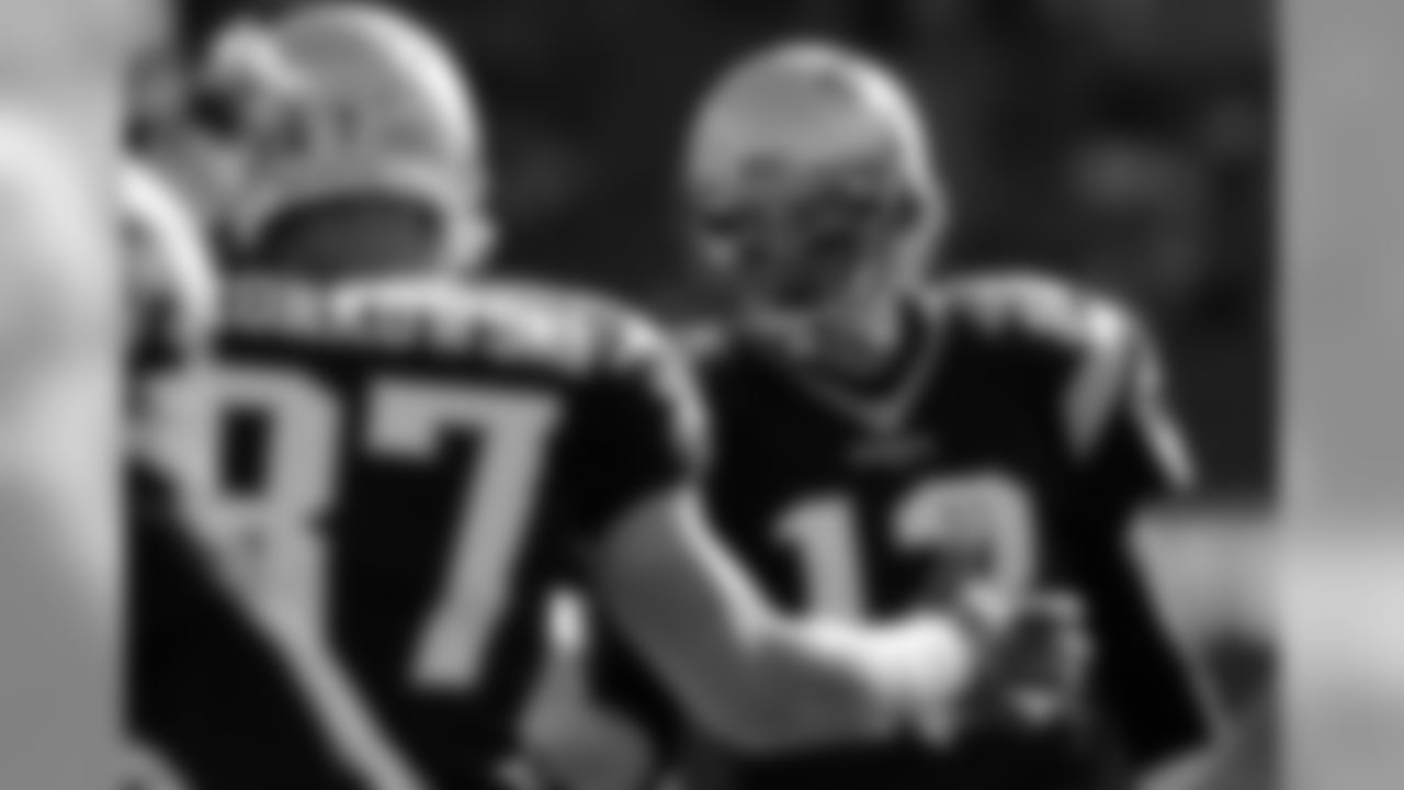 New England Patriots quarterback Tom Brady (12) talks with teammate Rob Gronkowski before an NFL football game between the New England Patriots and the Washington Redskins, Sunday, Nov. 8, 2015, in Foxborough, Mass. (AP Photo/Charles Krupa)