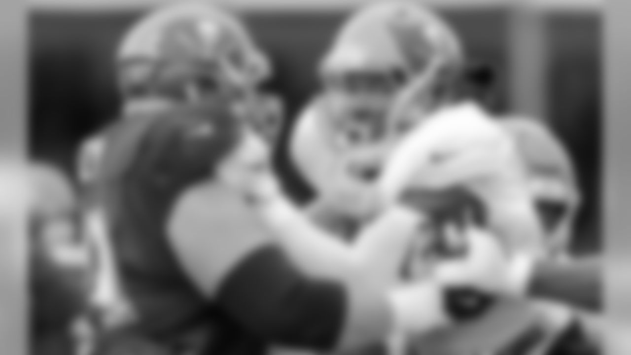 OG J.R. Sweezy & DE Ryan Russell