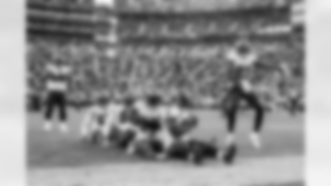 GREEN BAY, WI - JANUARY 24, 2021 - Inside Linebacker Devin White #45, Outside Linebacker Jason Pierre-Paul #90, Defensive Tackle Rakeem Nunez-Roches #56, Outside Linebacker Shaquil Barrett #58, and Cornerback Sean Murphy-Bunting #23 of the Tampa Bay Buccaneers celebrate a turnover during the NFC Championship game between the Tampa Bay Buccaneers and Green Bay Packers at Lambeau Field. The Buccaneers won the game 31-26. Photo By Kyle Zedaker/Tampa Bay Buccaneers