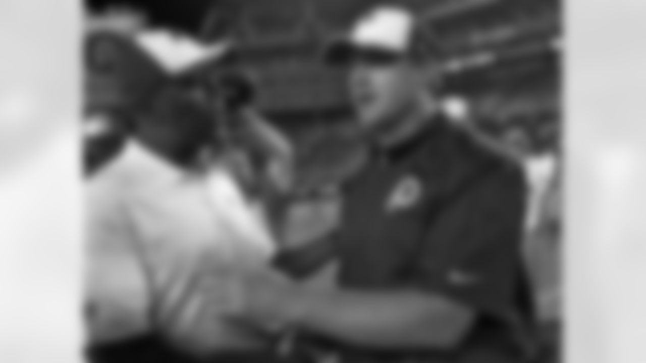 Washington Redskins head coach Jay Gruden, right, shakes hands with Tampa Bay Buccaneers head coach Lovie Smith after an NFL preseason football game Thursday, Aug. 28, 2014, in Tampa, Fla. the Redskins won the game 24-10. (AP Photo/Brian Blanco)