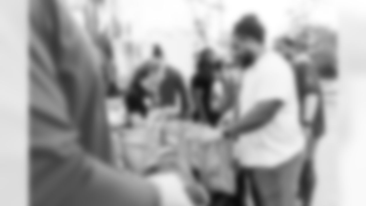 TAMPA, FL - November 23, 2022 - Defensive Tackle Vita Vea #50 of the Tampa Bay Buccaneers during the D-Line Mobile Food Pantry Thanksgiving food distribution event at Middleton High School. Photo By Kyle Zedaker/Tampa Bay Buccaneers