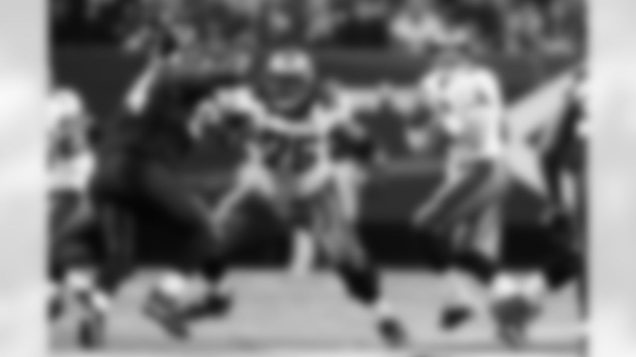 75 G Davin Joseph works to protect the quarterback