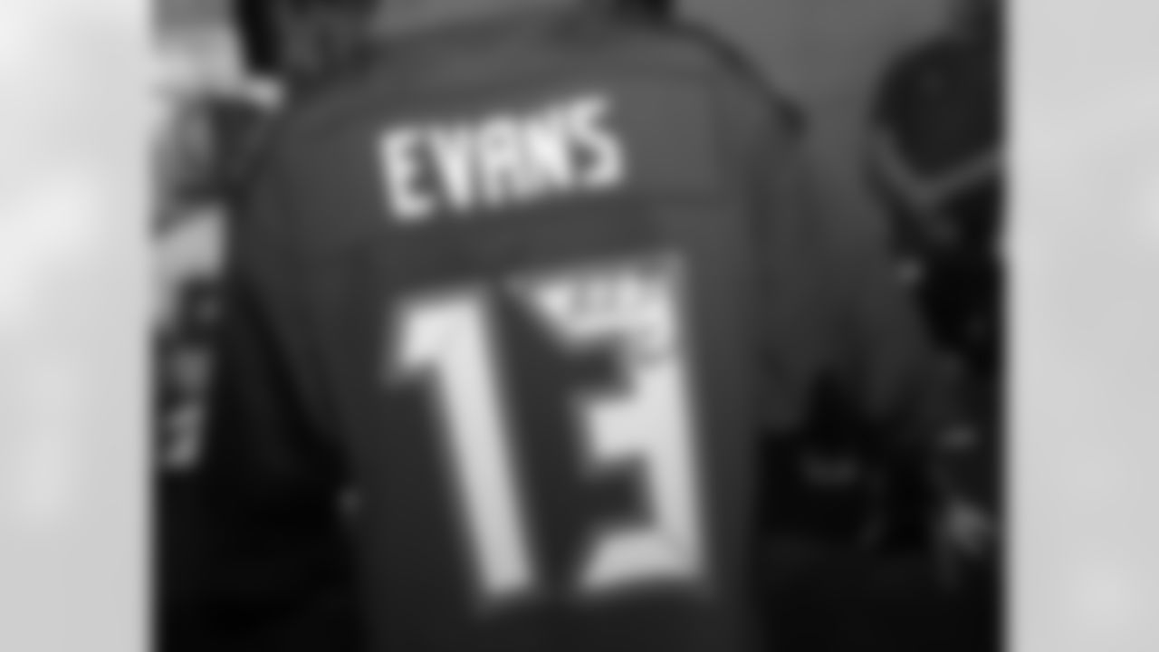 A fan shows off his newly autographed Mike Evans jersey