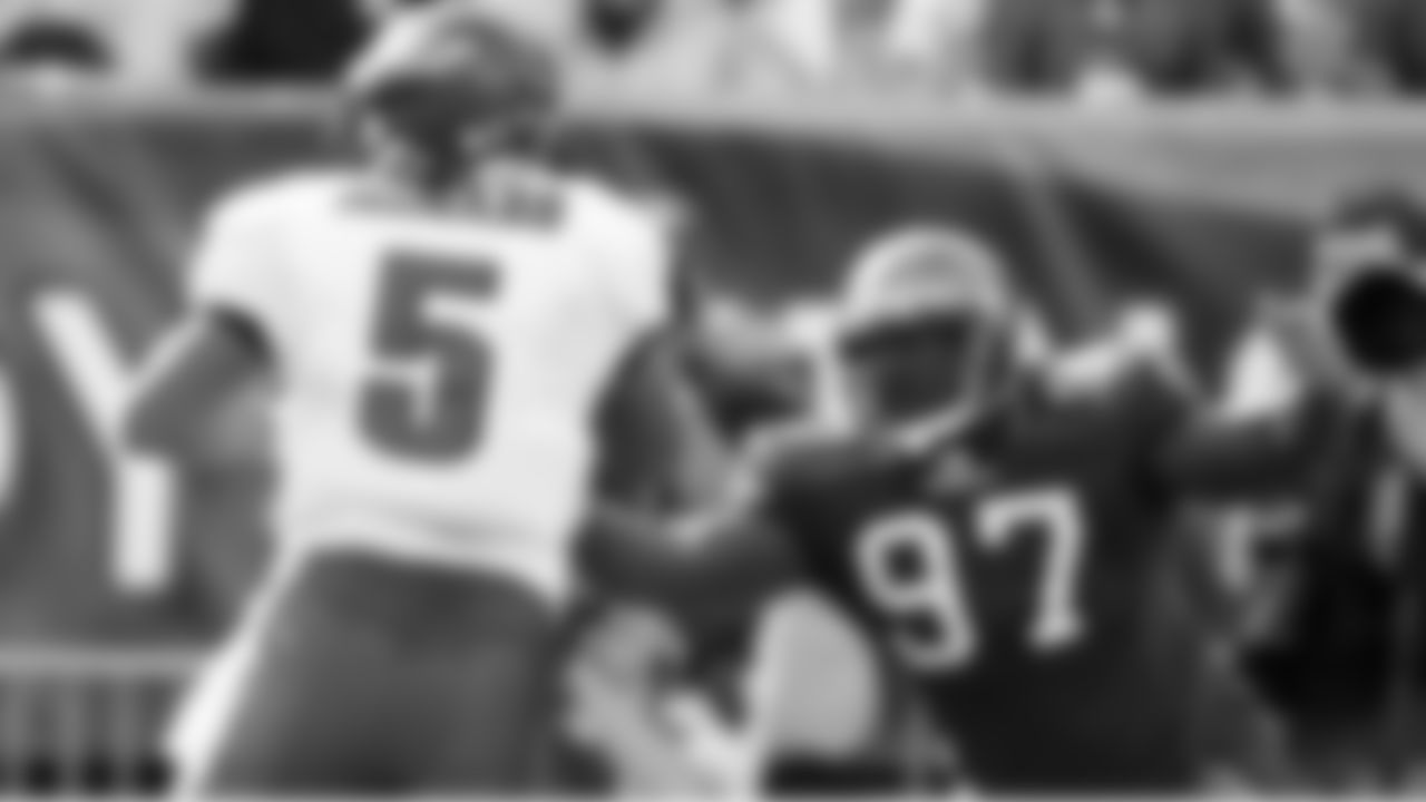 97 DE Jimmy Wilkerson moves in to sack the quarterback