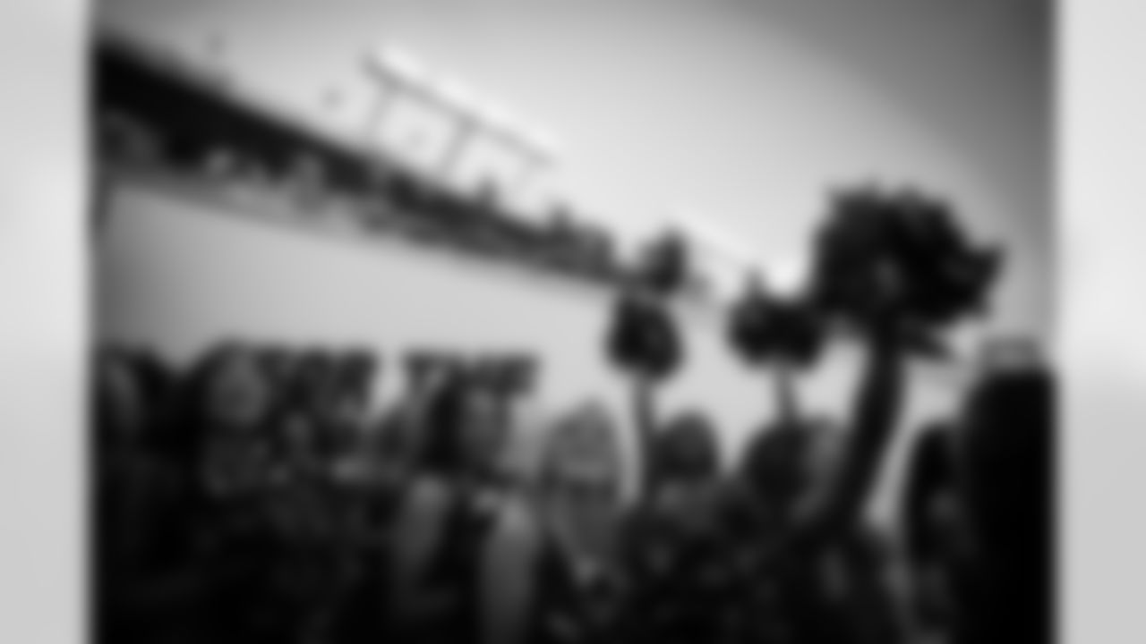 Tampa Bay Buccaneers cheerleaders look to the fans before a performance at the 8/8 preseason game.