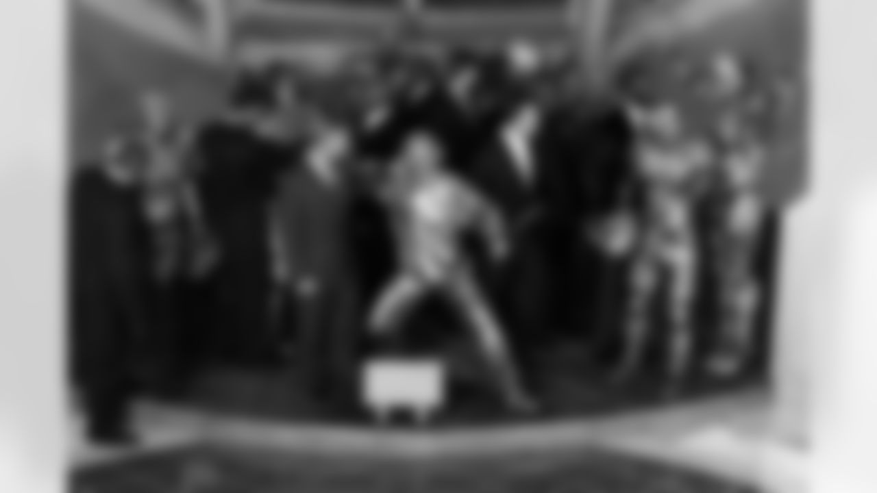 The nine men depicted in Moment of Victory get a close-up look at their likenesses