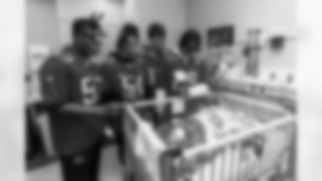 ST. PETERSBURG FL - December 13, 2022 - Inside Linebacker Olakunle Fatukasi #53, Inside Linebacker J.J. Russell #51, Tight End Cade Otton #88 and Running Back Rachaad White #29 of the Tampa Bay Buccaneers during the Rookie Club visit to Johns Hopkins All Children's Hospital. Photo By Tori Richman/Tampa Bay Buccaneers