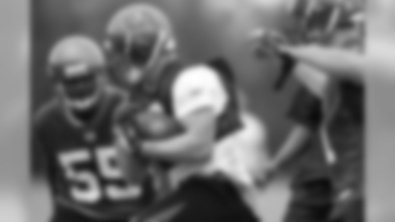 Practice squad FB Byron Storer braces for impact as he hustles through a crowded defense
