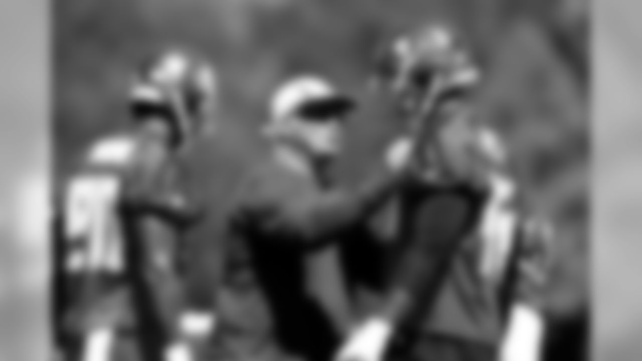 DC Mike Smith, DE Kourtnei Brown, and DE Howard Jones
