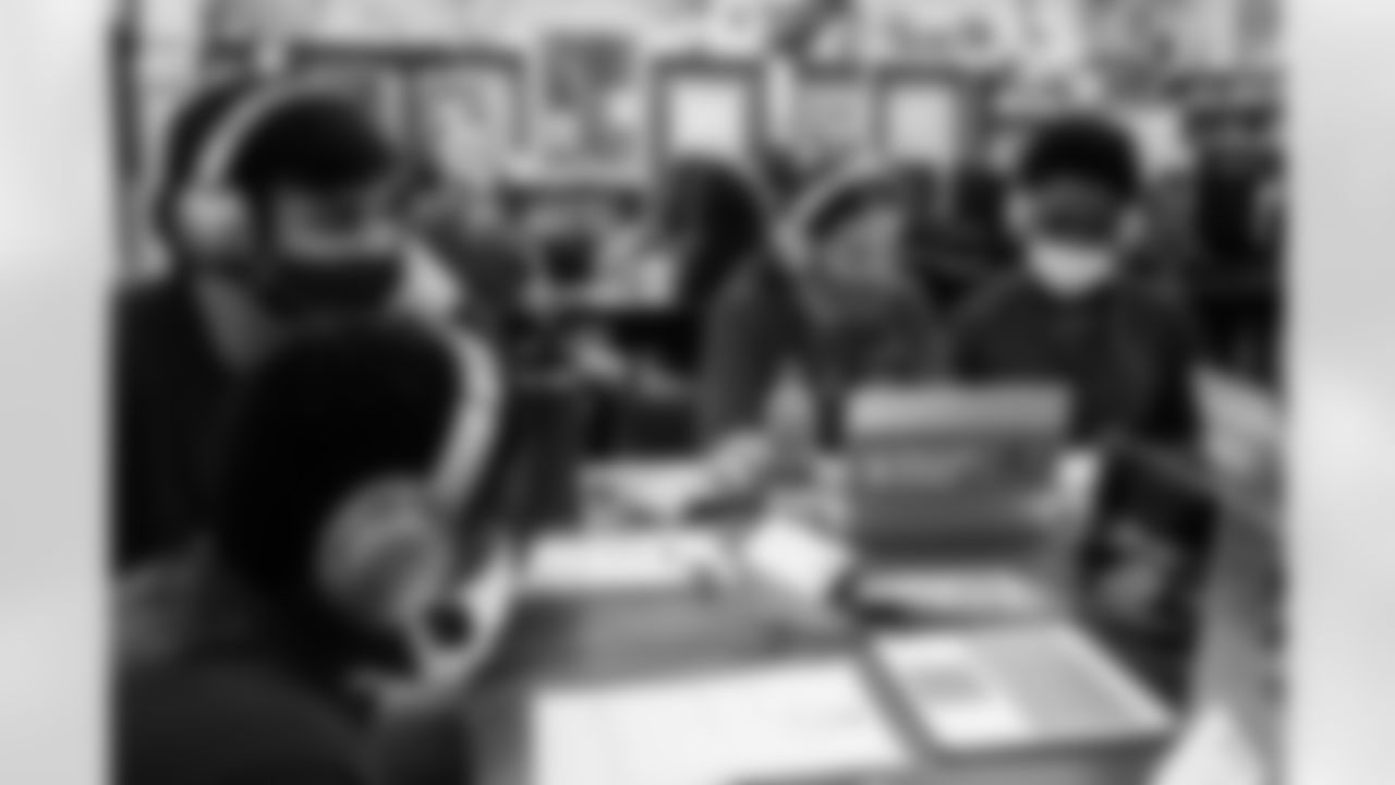 TAMPA, FL - OCTOBER 18, 2021 - Students at Young Middle School work with their mentors during the Tampa Bay Buccaneers Youth Leadership program. Photo By Tori Richman/Tampa Bay Buccaneers
