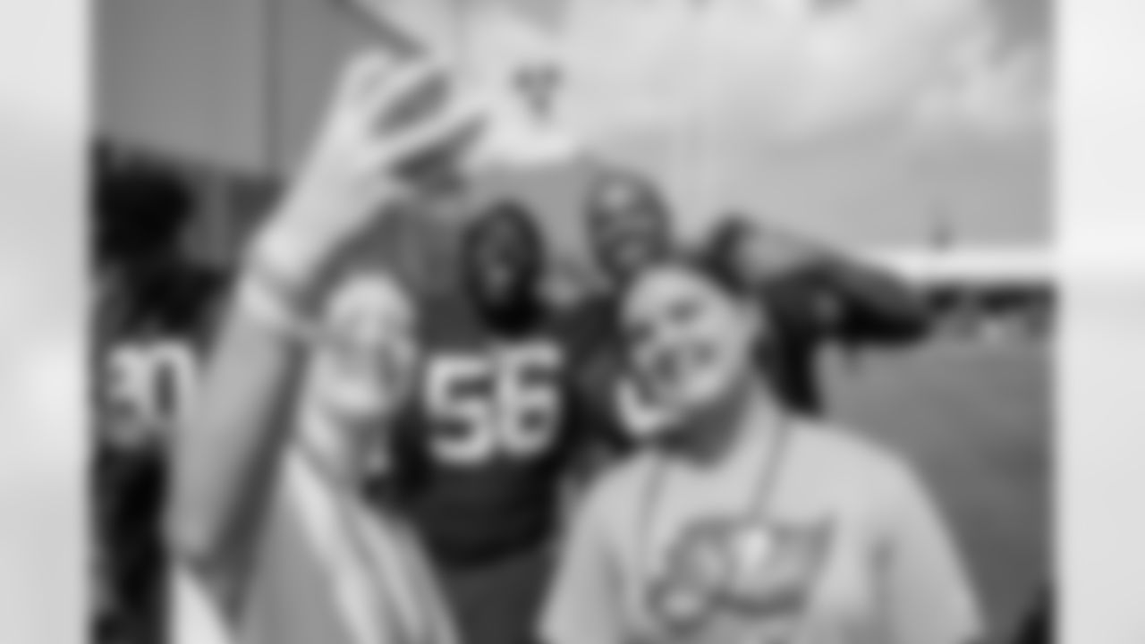 TAMPA, FL - July 28, 2022 - Defensive Tackle Rakeem Nunez-Roches #56 and Defensive Lineman William Gholston #92 of the Tampa Bay Buccaneers take a selfie with fans after 2022 Training Camp practice at AdventHealth Training Center. Photo By Kyle Zedaker/Tampa Bay Buccaneers
