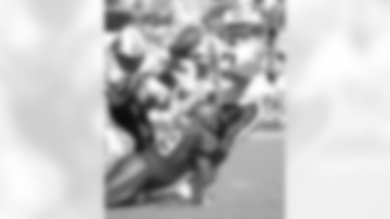 DT Warren Sapp - 77