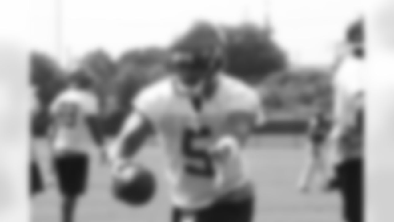 Rookie QB Josh Freeman works on the fake handoff of a play-action pass