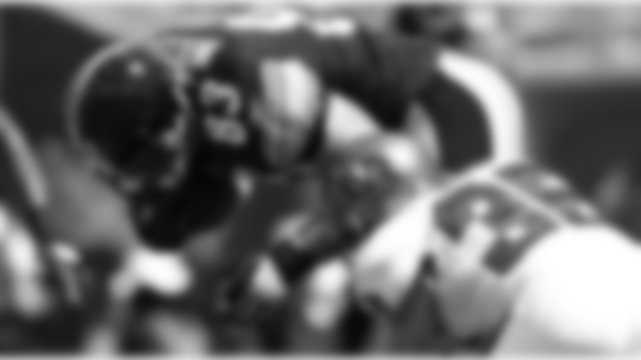 35 S Cody Grimm wrangles the ball carrier for a tackle