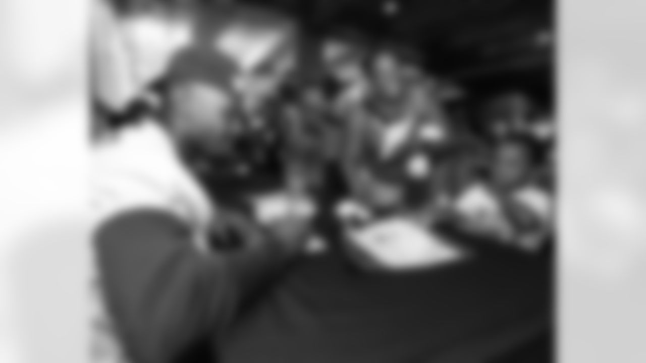 Players signed autographs before practice
