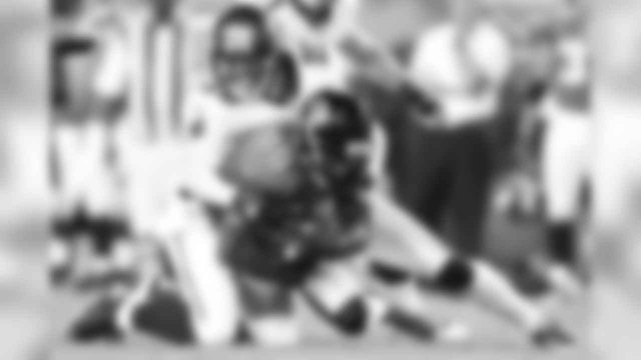 20 CB Ronde Barber powers down a receiver for the tackle