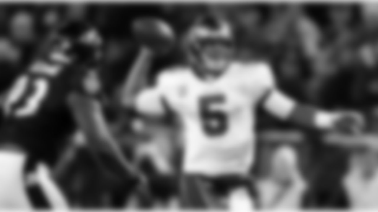 5 QB Josh Freeman throws a pass under pressure